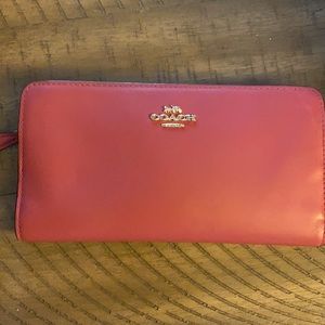 Coach Antique Rose colored wallet.